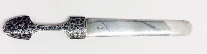 Russian silver-coloured metal paperknife with scroll decorated handle and inscribed with Russian