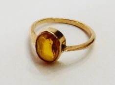 Gold-coloured metal and citrine-coloured stone dress ring, set oval cut stone