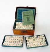 Chinese bone and bamboo mahjong set, with Pung Wo instruction manual, in leather case