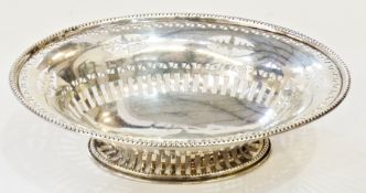 1920s oval pierced dish, beaded border, with stylised triangular pierced border below to pierced