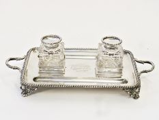Victorian silver inkstand, rectangular and two handled with gadrooned border, fitted pair cut