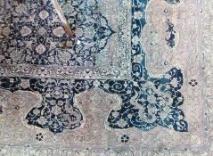 A Persian design Grosvenor Wilton carpet with blue floral spray border, blue central medallions