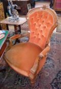 Late Victorian gentleman's walnut framed arm chair, having carved and moulded ornamentation, deep