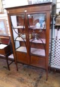 Edwardian inlaid mahogany china display cabinet, the bar glazed doors having painted roundels, on