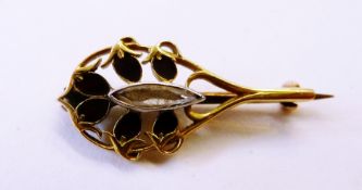 Yellow gold-coloured metal, diamond and enamel small brooch, in the form of stylised flowerhead with