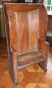 Eighteenth century elm settle chair with panelled back