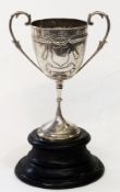 Early nineteenth century two-handled trophy cup, thin foliate scroll handles to decorated cup,