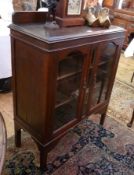 Twentieth century oak display cabinet, pair glazed panelled doors enclosing three shelves, on