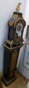 An ebonised and ormolu table clock with pedestal, with putto finial playing trumpet, other ormolu