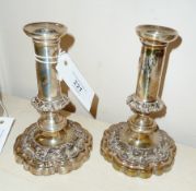 Pair dwarf candlesticks, the bases with repousse decoration, wavy edges, 18cm high approx.