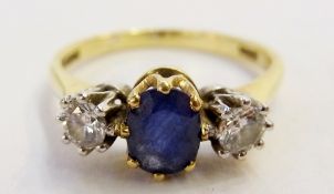 18ct gold, sapphire and diamond ring, set central oval sapphire flanked by two diamonds, claw set