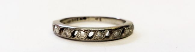 18ct white gold and diamond half eternity ring, the diamond set in pierced scroll setting