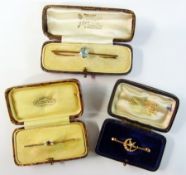Gold coloured metal seed pearl star and crescent bar brooch, cased, 14ct gold bar brooch set in a