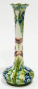 Early Moorcroft Florian type vase with an oblate body and elongated neck, frilled everted rim,