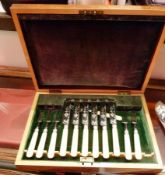 Cased set of bone-handled fish knives and forks, place settings for six persons, foliate engraved