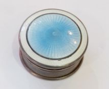 Early twentieth century circular silver and enamel pillbox, lid with white enamel border and blue