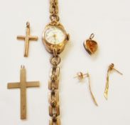 Lady's gold cased watch, on rolled gold bracelet, two gold crosses, pair gold drop earrings and gold