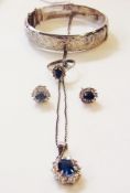 Silver pendant, set with blue oval central stone surrounded by white stones, matching pair earrings,