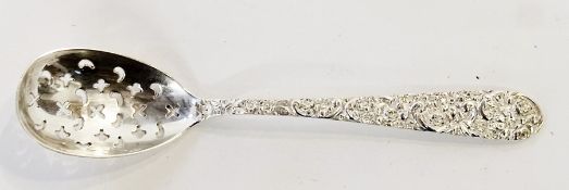 Jenkins & Jenkins sterling straining spoon, with ornate floral and scroll handle