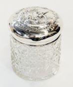 Heavy cut glass and silver mounted trinket box, square cushion shaped, the silver lid floral swag