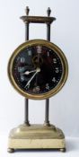 Brass rise and fall mantel clock with pendular escape movement