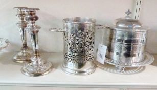 EPNS pierced bottle holder, and two unmarked silver plate candlesticks