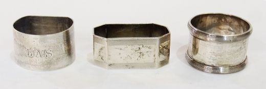 Silver napkin ring, octagonal and engine turned, another, half round and a plated napkin ring (3)