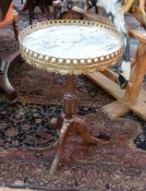 A French style circular occasional table, with gilt decoration, marble top and mahogany tripod