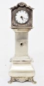 Dutch silver-coloured metal miniature model longcase clock with white enamel circular dial and bombe