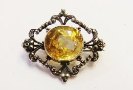 Silver coloured metal yellow sapphire marcasite brooch having central oval yellow sapphire approx