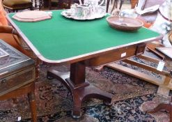 A mid nineteenth century mahogany foldover card table, raised on tapering column with concave