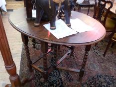 Twentieth century oak gateleg table, on spiral twist supports, united by stretchers