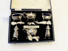 Eight piece silver condiment set viz: a pair mustards, salts, pepperettes all with serpentine