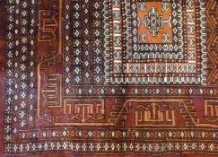 Pakistan wool rug, dark red ground, with geometric cream and orange pattern, 343 x 461cm