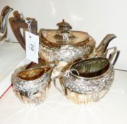Silver plated tea service, comprising teapot, sugar bowl and cream jug, (the handle of the cream jug