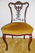 Set of four Edwardian mahogany framed dining chairs, having shell carved and shaped crestrail,