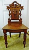 Victorian mahogany hall chair, with carved, shaped and pierced back, on turned supports