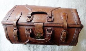 A large leather Gladstone bag