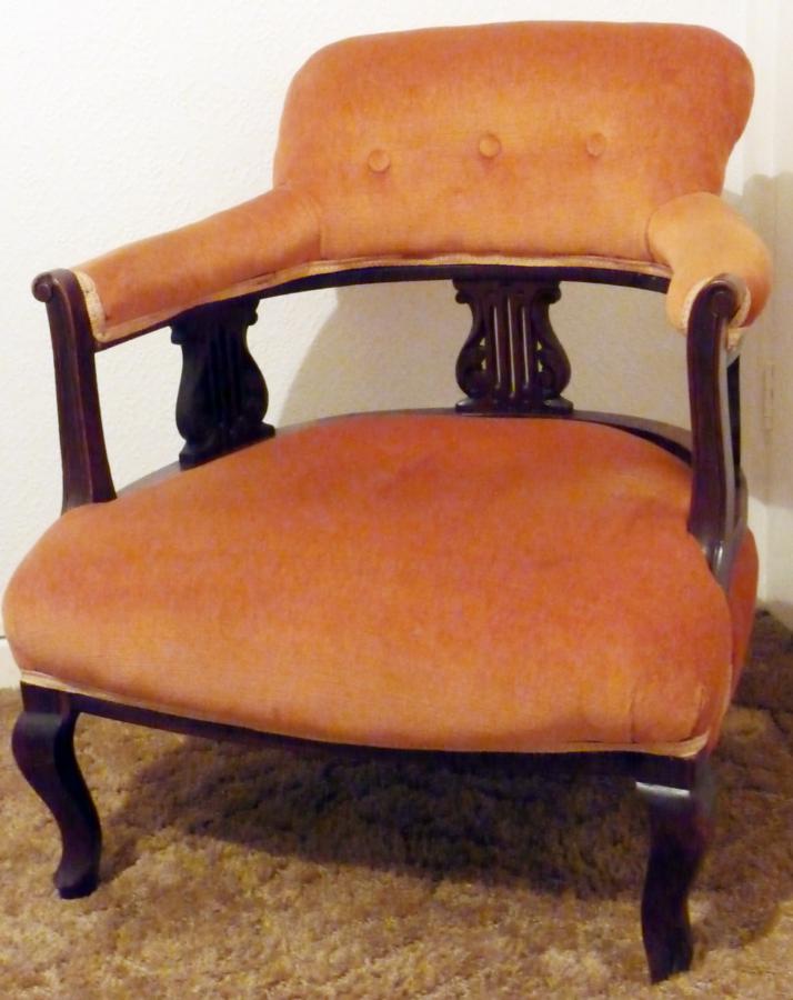An Edwardian mahogany framed tub chair with pierced lyre-shaped splats