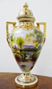 Noritake two-handled vase with cover, decorated with a lakescape with trees, buildings and swans