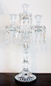 Glass four-light candelabrum, each candle sconce with prismatic drops, 50cm high
