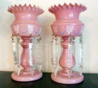 Pair late nineteenth century pink glass lustre vases, with prismatic drops, having enamel painted