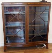 Mid-twentieth century dwarf mahogany bookcase/display cabinet, enclosed by pair astragal bar