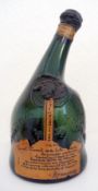 Old green glass armagnac bottle, issued to commemorate the Universal Exhibition of 1937, and four