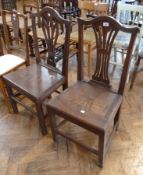 A nineteenth century country Hepplewhite style dining chair with pierced splat, solid seat, raised