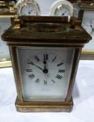 French carriage clock timepiece with brass case and glazed panels, enamel dial, supplied by Jack &