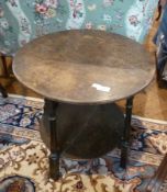 Circular mahogany two-tier occasional table, on turned supports