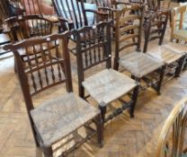 Two Lancashire spindle back dining chairs, with rush seats, turned legs united by stretchers, a rush