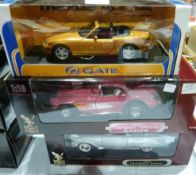 A 1-18 scale diecast metal model of a Mazda Omex 5, a 1957 Chevrolet Mermaid and a 1957 Chevrolet