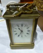 A Swiss carriage clock timepiece, in brass case with bevel glazed panels, enamel dial, height 13cms